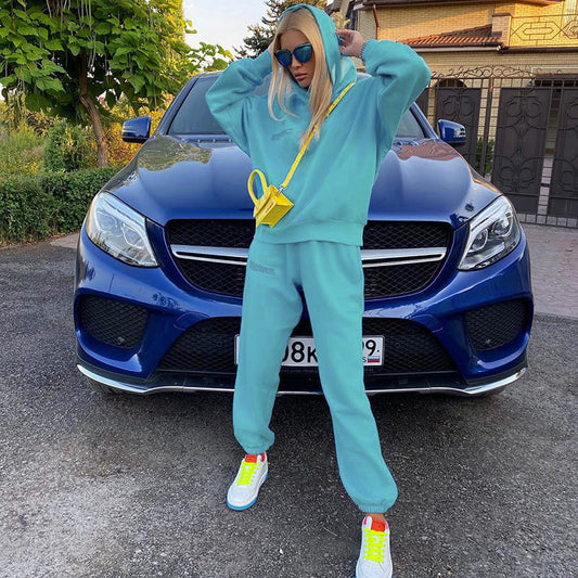 Teal loose jogger pants with tapered legs and elastic ankle cuffs