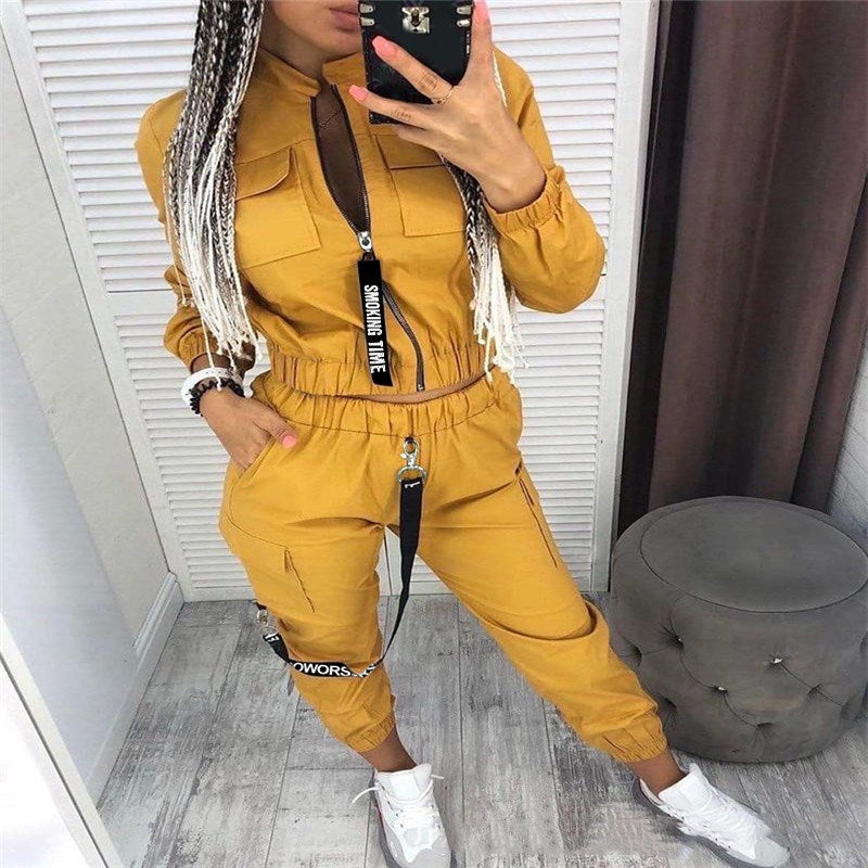 Mustard yellow zip-front jumpsuit set with cargo pockets and drawstring waist, long sleeves