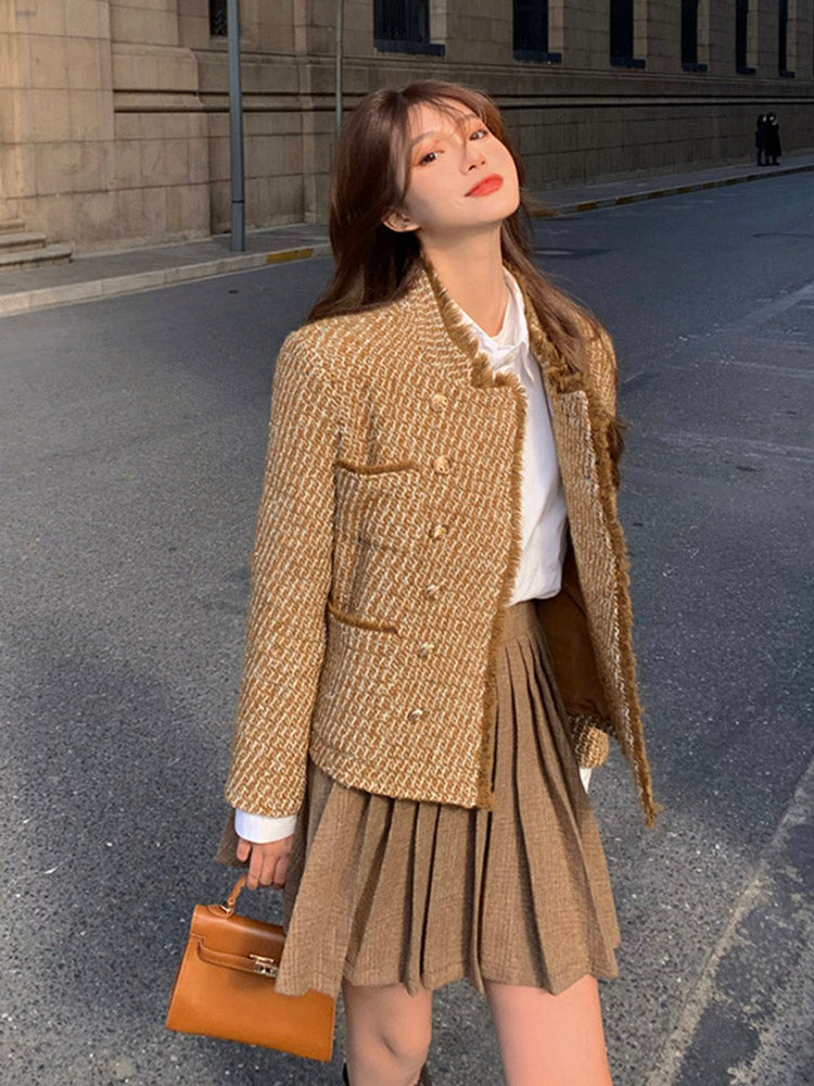 Tweed woolen jacket with gold buttons and white ruffle collar; pleated mini skirt