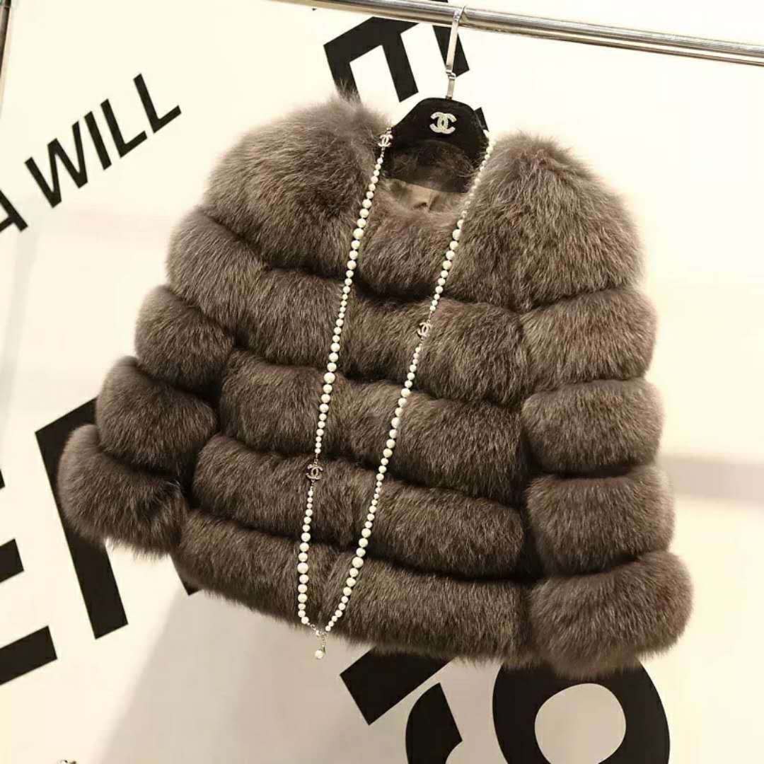 Women’s gray fur cropped jacket with wide collar and long pearl-bead trim detail.