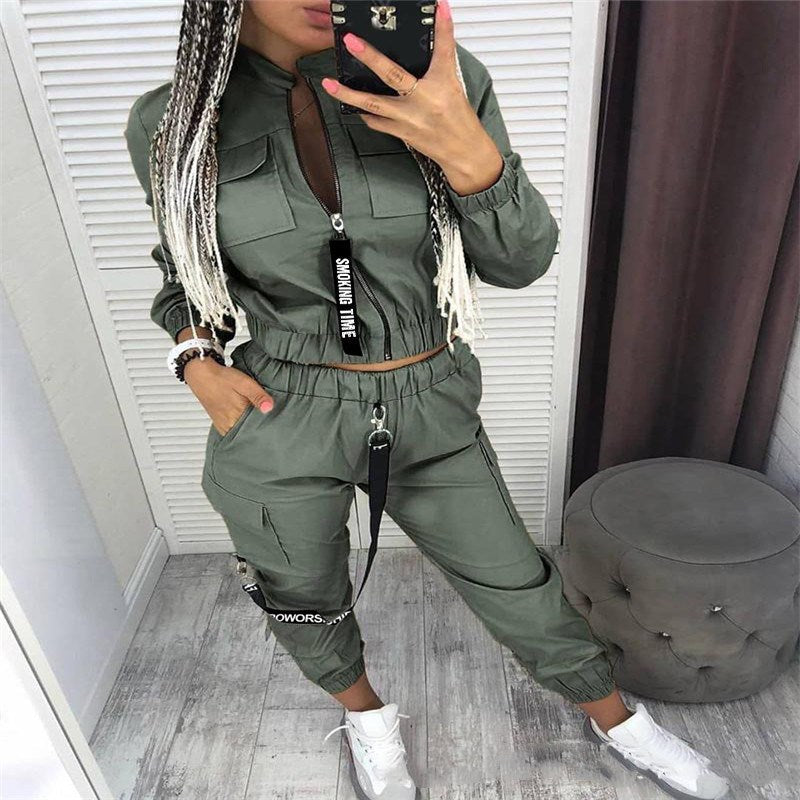 Olive green zip-front jumpsuit set with cargo pockets and drawstring waist, long sleeves