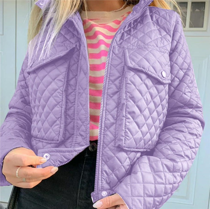 Purple quilted winter jacket with zip front and flap chest pockets.