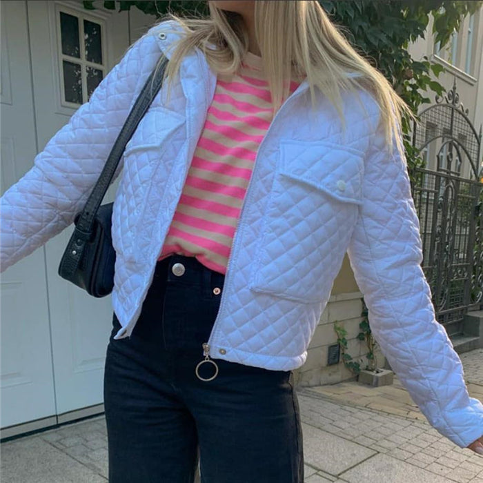 Light blue quilted winter jacket with side pockets and zipper front.